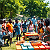 Post: The image depicts a lively outdoor gathering, showcasing a community barbecue or picnic among Black...